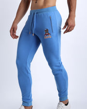 Side view of the CITY BLUE men's sweatpants with zipper pockets by BANG! Clothes based in Miami. This jogger is soft and skin-friendly with two pockets to store small things like phone and keys.