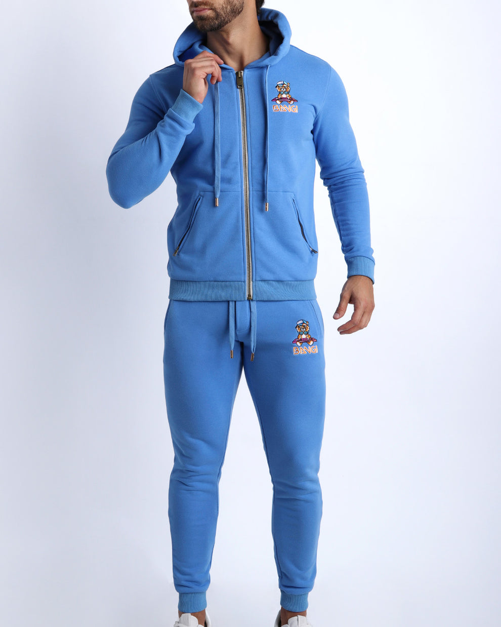 Frontal view of the matching CITY BLUE Tracksuit Hoodie Jacket and the Tracksuit Pants for men in a soft moisture wicking and breathable tracksuit set. 