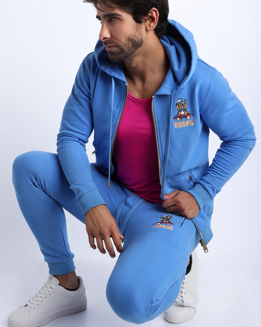 Sexy male model wearing the perfect light blue color men's sweatpants with zipper pockets to keep you warm during chilly fall weather. With it's soft, warm fabric and it's adjustable drawstring closure for custom fit.