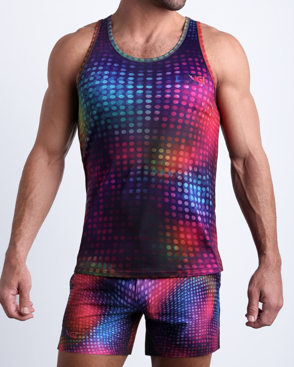 Model wearing the CONFESSIONS ON A SAND FLOOR matching swimming shorts and tank top for a complete look by BANG! Clothes from Miami.