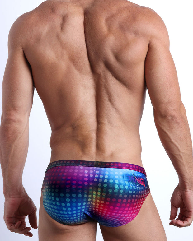 Back view of male model wearing the CONFESSIONS ON A SAND FLOOR beach briefs for men by BANG! Miami in multiple colors Disco Ball design.