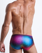 Back view of a Male model wearing Brazilian Beach Sunga Swimsuit for men in multiple colors Disco Ball design inspired by dance floor and madonna by the Bang! Clothes brand of men's beachwear.