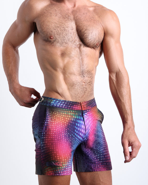 Side view of the men’s CONFESSIONS ON A SAND FLOOR shorter leg length shorts in a pop color disco ball print made by Miami based Bang! brand of men&