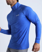 Side view of men’s performance exercise top in bold blue color made by BANG! Clothing the official brand of mens sportswear. 