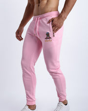 Side view of the EURO PINK men's sweatpants with zipper pockets by BANG! Clothes based in Miami. This jogger is soft and skin-friendly with two pockets to store small things like phone and keys.