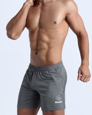 Side view of men’s performance exercise shorts in a stone grey color made by BANG! Clothing the official brand of mens sportswear. 