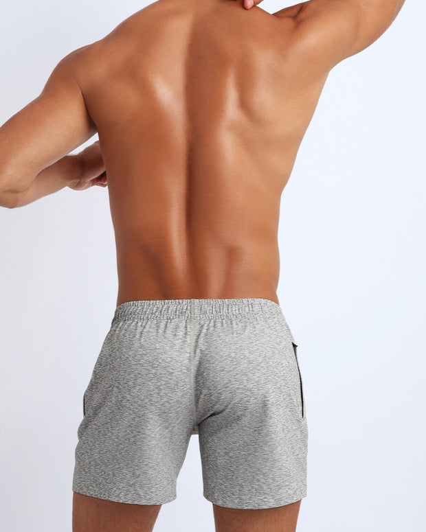 Back view of a sexy male model wearing BANG Miami jogger shorts workout calisthenics yoga chill lightweight odor free sweat proof