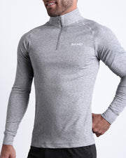 Side view of men’s performance exercise top in a heathered grey color made by BANG! Clothing the official brand of mens sportswear.