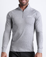 Frontal view of male model wearing the GREY ANATOMY in a solid gray quick-dry long-sleeve shirt by the Bang! brand of men's beachwear from Miami.