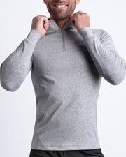 Frontal view of male model wearing the GREY ANATOMY in a solid gray quick-dry long-sleeve shirt by the Bang! brand of men's beachwear from Miami.