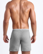Back view of the men's above-knees length fitness workout shorts in a grey color by BANG! menswear Miami.