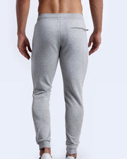 Back view of men's high quality outdoor track pants in a solid light grey color with back zippered pocket. Suitable for daily, running, working out, exercise and hanging out in Winter.