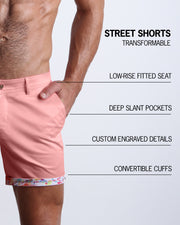 Men tailored fit chino shorts in IBIZA PINK by Bang! Keeps you feeling comfortable and looking sharp all. Classic chino shorts for men in a cotton blend from Bang! Clothing from Miami. Features two front pockets and custom engraved button front closure with zip fly. Can roll-up cuffs for shorter length and showing internal print. Or hem down for a mid-thigh length and full-solid pink color showing.