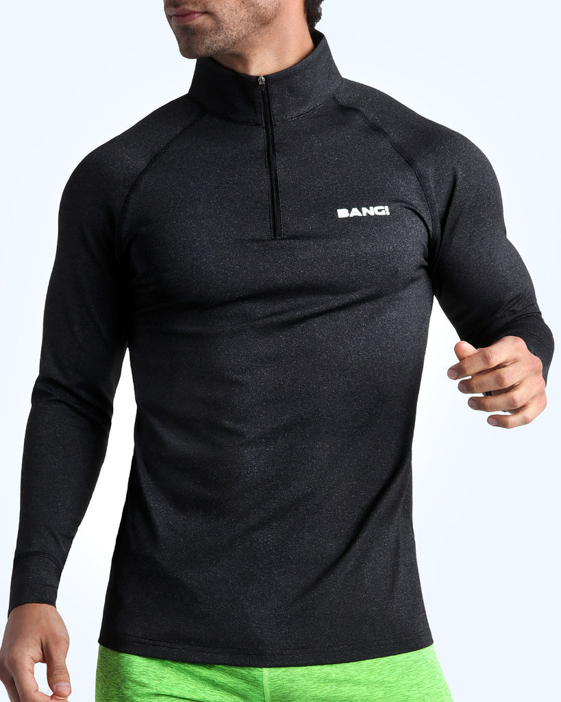 Frontal view of male model wearing the IRON BLACK in a solid black quick-dry long-sleeve shirt by the Bang! brand of men's beachwear from Miami.