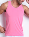 Frontal view of male model wearing the LA BEACH EN ROSE in a pink men's gym tank top by the Bang! brand of men's beachwear from Miami.