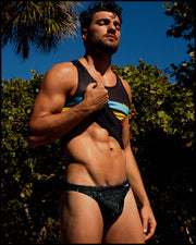 Front view of a sexy male model wearing a BANG Miami swim-mini brief in the new matrix print premium fit and designer quality 2023