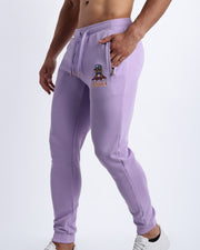 Side view of the METRO PURPLE men's sweatpants with zipper pockets by BANG! Clothes based in Miami.This jogger is soft and skin-friendly with two pockets to store small things like phone and keys.