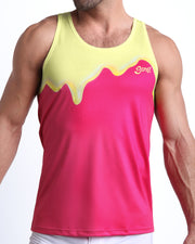 Front view of model wearing the MY MILKSHAKE men’s beach tank top in pink & yellow melting ice cream print by the Bang! Clothes brand of men's beachwear from Miami.