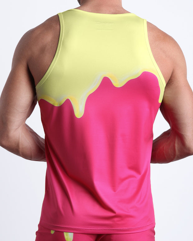 Back view of male model wearing the MY MILKSHAKE summer tank top for men by BANG! Miami in a hot pink color with yellow melting graphic.