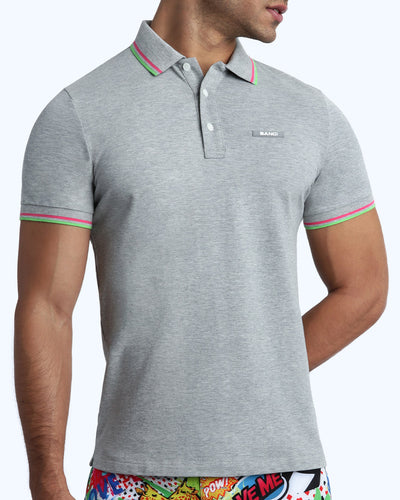 Front view of a sexy male model wearing a premium 100% Cotton Pique Polo Shirt for men from BANG! Brand in a grey color.