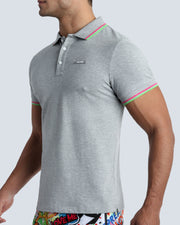 Side view of a male model wearing a slim fit sexy collared shirt for men from BANG! Miami in stone gray color. 