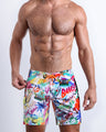 Frontal view of male model wearing the PEOPLE FROM IBIZA men's premium quality flex boardshorts by the Bang! Clothes brand of men's swimwear from Miami.