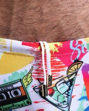 Close-up view of the PEOPLE FROM IBIZA Swim Sunga mens swimsuitin white with colorful pop art with an internal drawstring cord in white showing custom branded golden buttons by BANG! clothing brand.