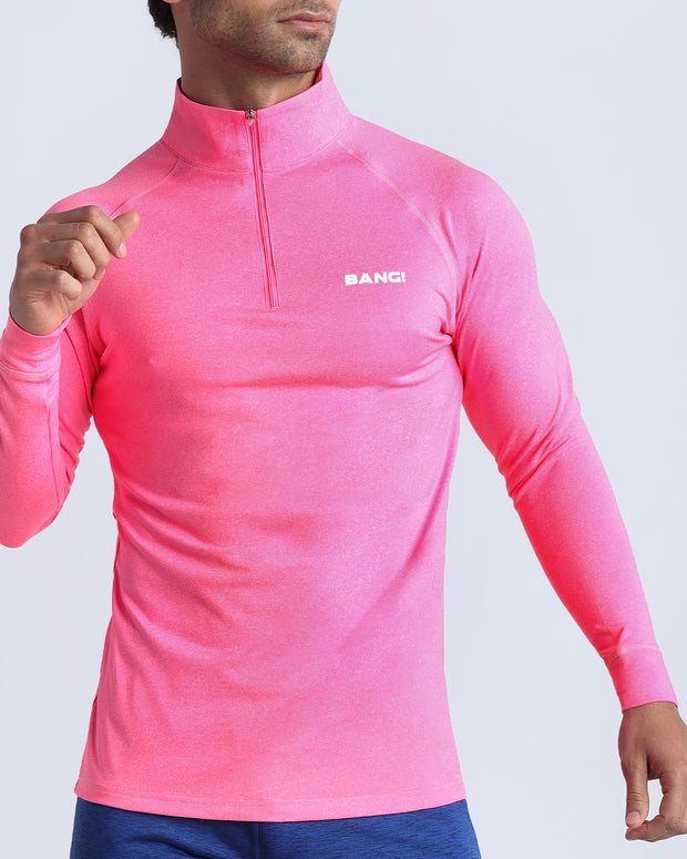 Frontal view of male model wearing the PINKTENSITY in a solid fluorescent pink quick-dry long-sleeve shirt by the Bang! brand of men&