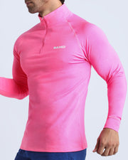 Back view of the PINKTENSITY men's fitness pullover shirt in a neon pink color by BANG! menswear Miami.