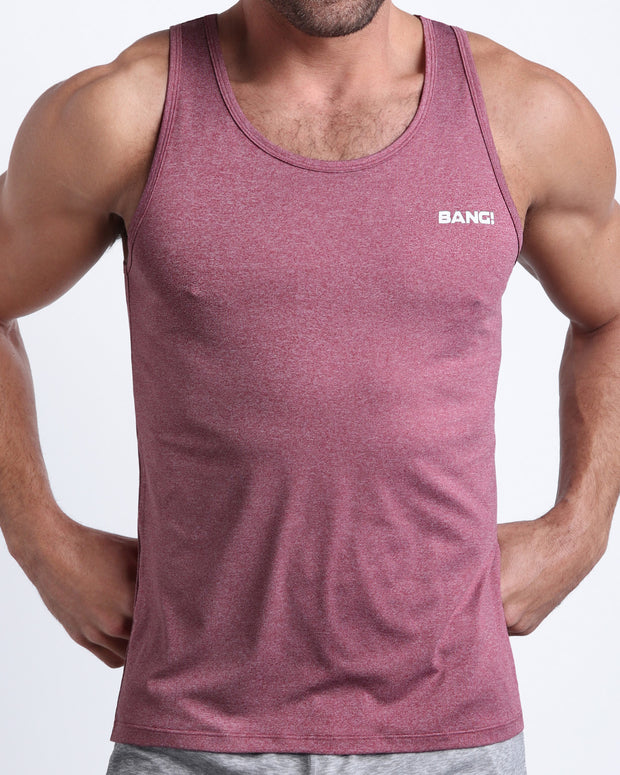 Frontal view of male model wearing the RIPPED CRIMSON in a heathered red gym tank top for men by the Bang! brand of men&