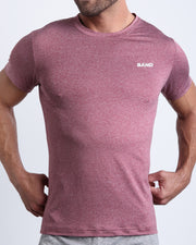 Frontal view of male model wearing the RIPPED CRIMSON in a solid heathered red quick-dry workout shirt by the Bang! brand of men's beachwear from Miami.