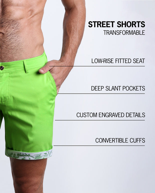 Infographic explaining the features of the SPLENDID GREEN Street Shorts by BANG! Clothes. These transformable chino shorts are low-rise fitted seat, have deep slant pockets, custom engraved details, and convertible cuffs exposing exclusive print.
