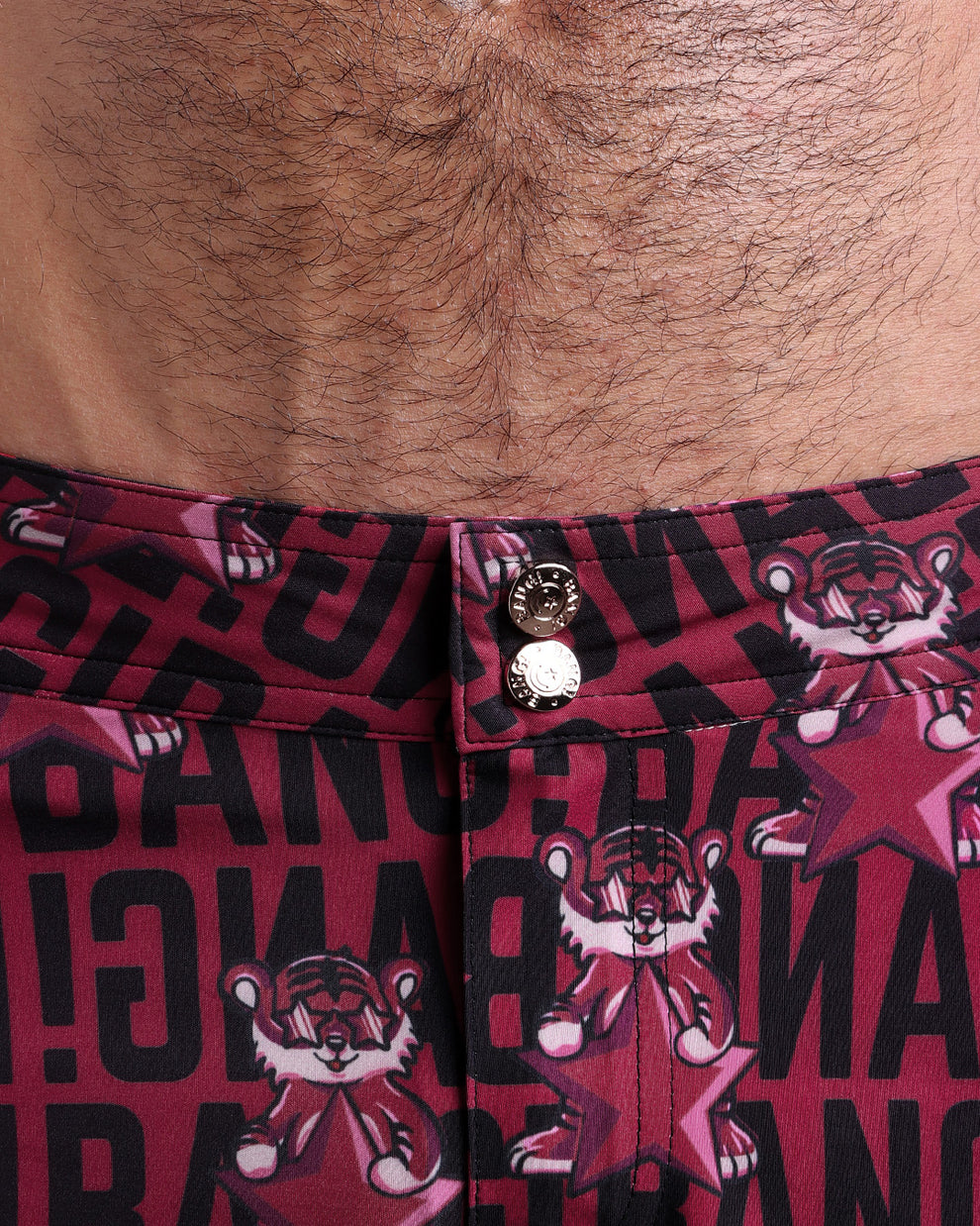 Close-up view of men’s summer beach shorts by BANG! clothing brand, showing custom branded golden buttons.