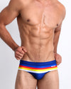 Frontal view of model wearing Stripe'A'Pose men’s swimwear by the Bang! Clothes brand of men's beachwear from Miami.
