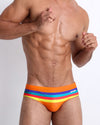 Frontal view of model wearing Stripe A Pose men's swimwear bottom by the Bang! Clothing brand of men's beachwear from Miami.