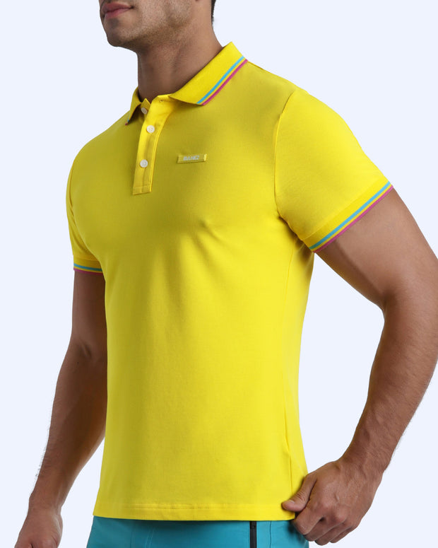 Side view of a male model wearing a slim fit sexy collared shirt for men from BANG! Miami in a STUNNING YELLOW color.