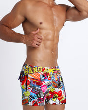 These Super Pop sexy swims trunks for men feature fun and enegetic comics-style graphics in bold colors with a prominent BANG! sign.