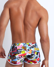 Back view of a sexy male model wearing men's swimwear with pop-culture theme made by the Bang! brand of men's beachwear.