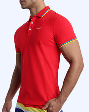 Side view of a male model wearing a slim fit sexy collared shirt for men from BANG! Miami in a gorgeous red color.