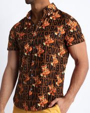 Side view of the TIGER HEARTS men’s Summer button down featuring a black and brown Tiger Pop Art Monogram print with front pocket by Miami based Bang brand of men's beachwear.