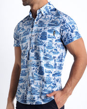Side view of the TOILE DE MIAMI (BLUE) men’s Summer button down in white with blue artwork with front pocket by Miami based Bang brand of men's beachwear.