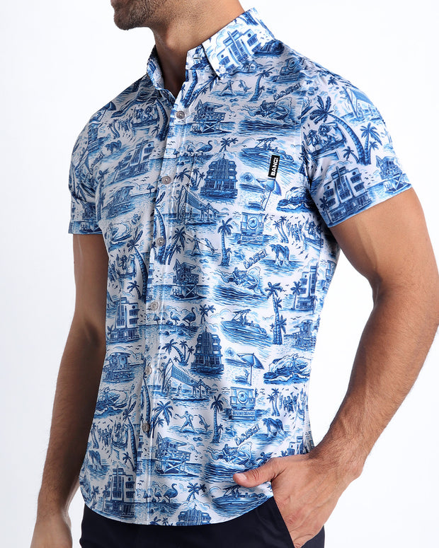 Side view of the TOILE DE MIAMI (BLUE) men’s Summer button down in white with blue artwork with front pocket by Miami based Bang brand of men&