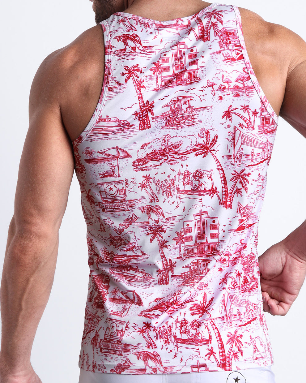 Back view of male model wearing the TOILE DE MIAMI (RED) summer tank top for men by BANG! Miami featuring in white with red art.
