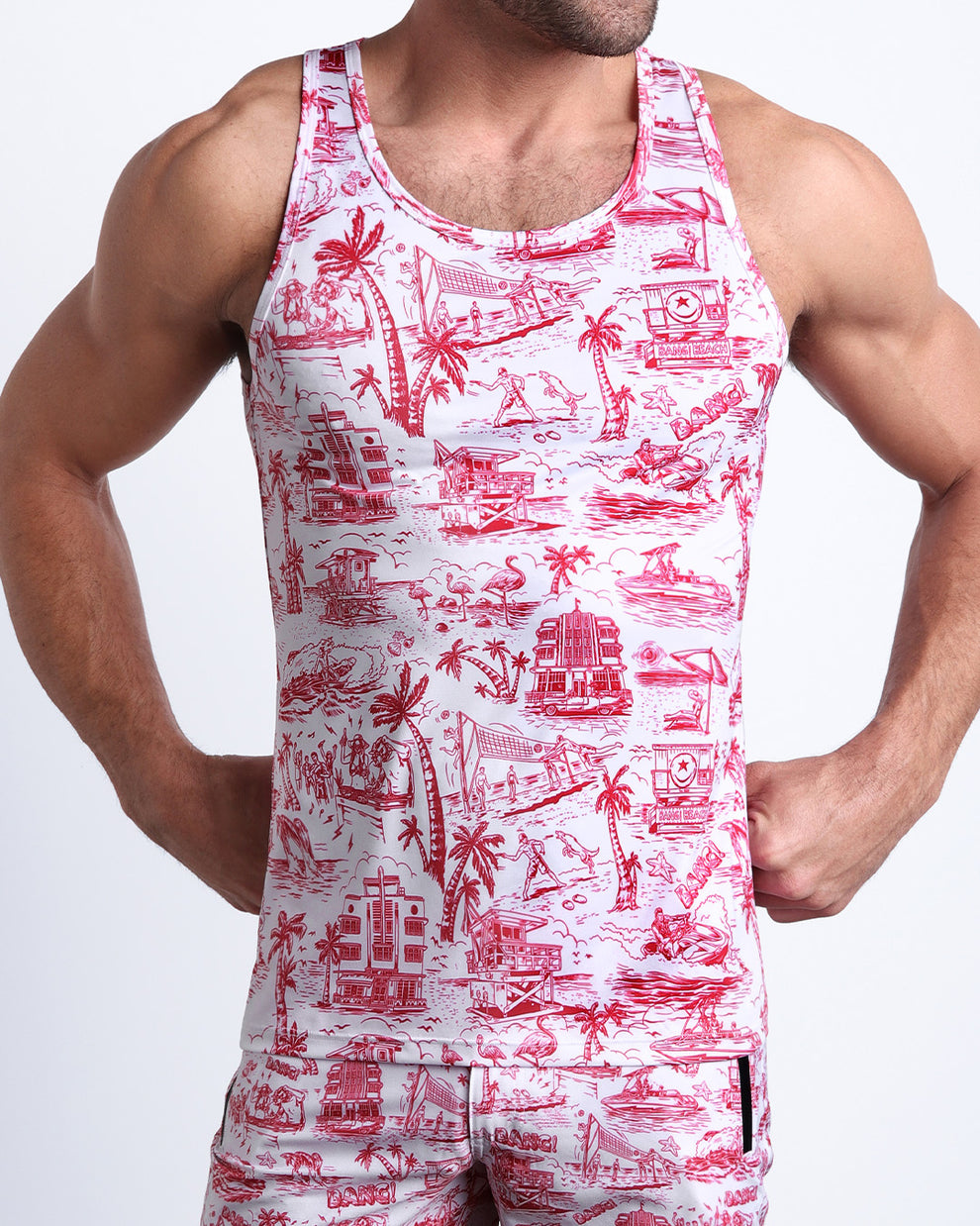 Model wearing the TOILE DE MIAMI (RED) matching beach shorts and tank top for a complete look by BANG! Clothes from Miami.