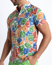 Side view of the VIA POSTAL men’s Summer button down in a colorful postal stamps graphic with front pocket by Miami based Bang brand of men's beachwear.