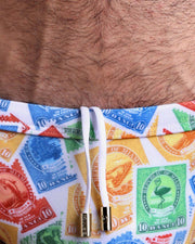Close-up view of the VIA POSTAL men’s drawstring briefs showing white cord with custom branded golden cord ends, and matching custom eyelet trims in gold.