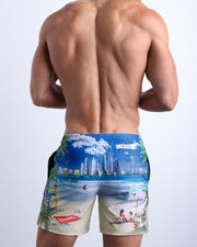 Back side of the WISH YOU WERE HERE beach mens swimsuit in Sky Blue & Miami Beach theme with BANG! Logo.