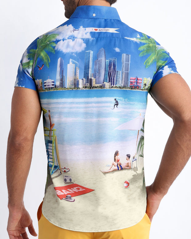 Back side of the WISH YOU WERE HERE stretch shirt for men in white with a beach inspired art by BANG! Miami.