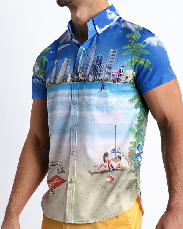 Side view of the WISH YOU WERE HERE men’s Summer button down featuring a colorful Miami inspired artwork with front pocket by Miami based Bang brand of men&
