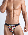 Frontal view of model wearing the YEAH YEAH Cotton Jockstrap for men in a black color with graffiti-theme inspired by music by BANG! Clothes